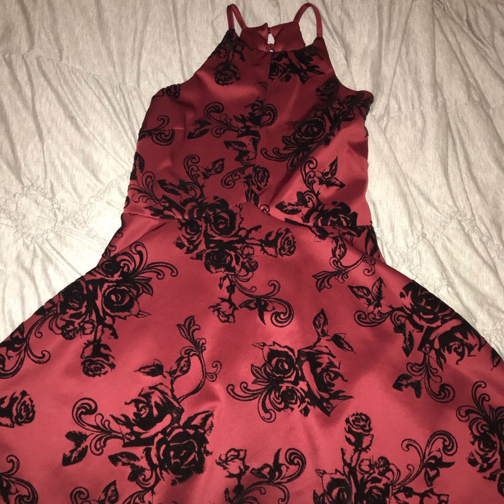 Red Homecoming dress with black flowers on it